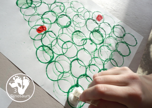 Christmas Tree Paper Roll Painting - a fun painting craft that you can do with kids to make a Christmas tree - 3Dinosaurs.com