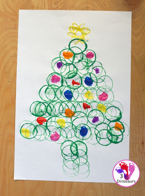 Christmas Tree Paper Roll Painting - a fun painting craft that you can do with kids to make a Christmas tree - 3Dinosaurs.com