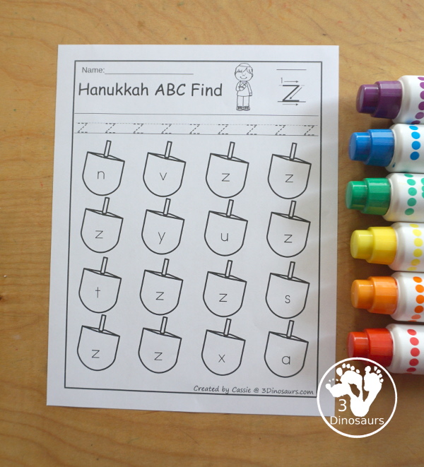 Hanukkah ABC Letter Find Printable - with uppercase letter find and lowercase letter find. You trace the letters and find the letters on the dreidels. A great letter printable for prek and kindergarten - 3Dinosaurs.com