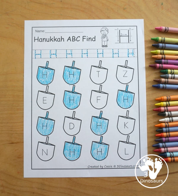 Hanukkah ABC Letter Find Printable - with uppercase letter find and lowercase letter find. You trace the letters and find the letters on the dreidels. A great letter printable for prek and kindergarten - 3Dinosaurs.com