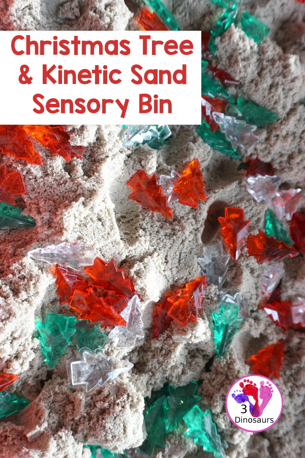 Christmas Tree & Kinetic Sand Sensory Bin - a simple sensory bin with a mix of red, green and clear evergreen trees in a kinetic sand fill for the sensory bin. This sensory bin is in a small paper bin that is great for sensory play with small groups. - 3Dinosaurs.com