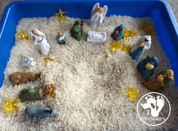 Nativity Sensory Bin For Christmas - a simple sensory bin to explore parts of the nativity with kids. You have nativity figures, rice and stars in this Christmas sensory bin. - 3Dinosaurs.com