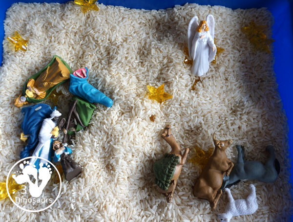 Nativity Sensory Bin For Christmas - a simple sensory bin to explore parts of the nativity with kids. You have nativity figures, rice and stars in this Christmas sensory bin. - 3Dinosaurs.com