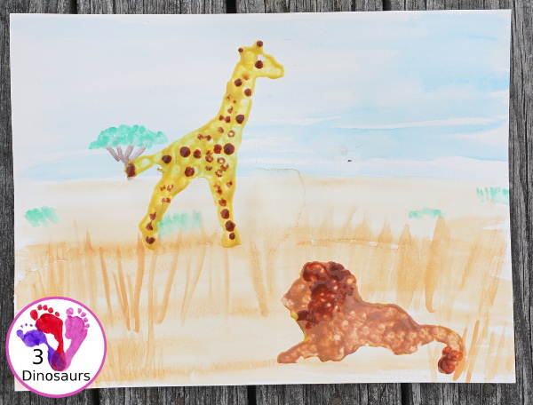 Giraffe & Lion Painting with Lions at Lunchtime - a fun watercolor and cookie cutter painting activity to make an African animal scene - 3Dinosaurs.com