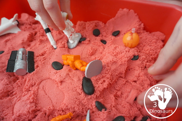 Mars Themed Sensory Bin with kinetic sand - a fun way to explore the red planet Mars -  3Dinosaurs.com