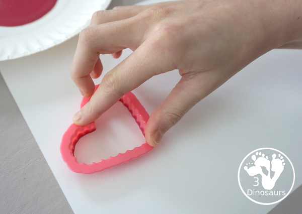 Heart Cookie Cutter Painting - a super easy craft for kids to do with cookie cutters and paint that you can do with tot, preschool and kindergarten - 3Dinosaurs.com