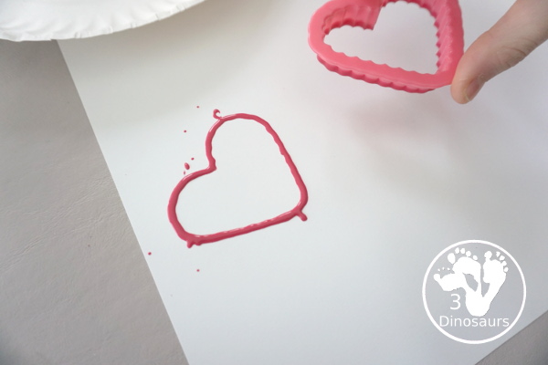 Heart Cookie Cutter Painting - a super easy craft for kids to do with cookie cutters and paint that you can do with tot, preschool and kindergarten - 3Dinosaurs.com