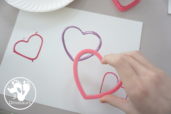 Heart Cookie Cutter Painting - a super easy craft for kids to do with cookie cutters and paint that you can do with tot, preschool and kindergarten - 3Dinosaurs.com