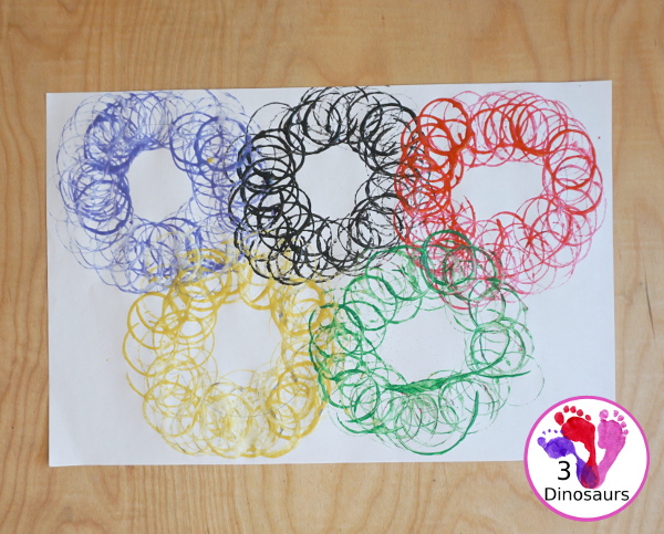 Paper Roll Olympic Rings Painting - an easy Olympic craft that you can use with kids to make an Olympic flag - 3Dinosaurs.com