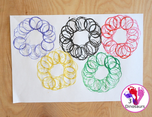 Paper Roll Olympic Rings Painting - an easy Olympic craft that you can use with kids to make an Olympic flag - 3Dinosaurs.com