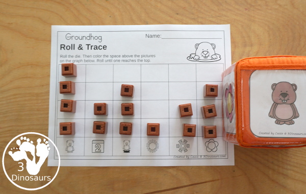 Groundhog Roll & Graph With Trace Letters, Numbers & Shapes with a folding die and cube die with a graphing sheet, graphing with tracing numbers, graphing with tracing letters and graphing with tracing shapes. All with a fun Groundhog theme for Groundhog Day for prek and kindergarten - 3Dinosaurs.com