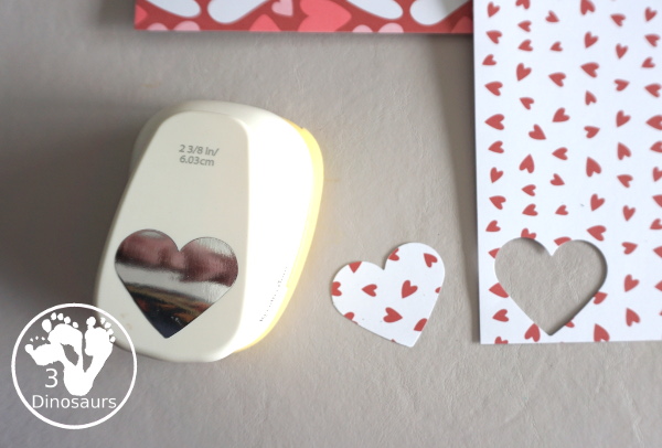 Valentines Heart Wreaths with Scrapbook Paper a fun paper plate wreath made using a heart punch and loads of fun for Valentines Day - 3Dinosaurs.com