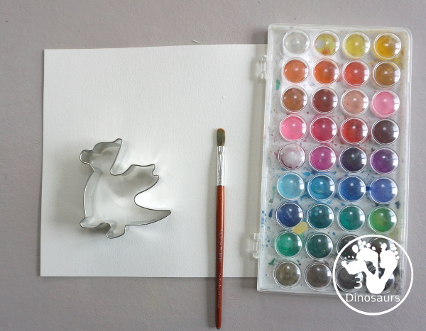 Dragon Watercolor Painting with rainbow color dragons made with a dragon cookie cutter and watercolor paints. A simple painting activity for different ages- 3Dinosaurs.com