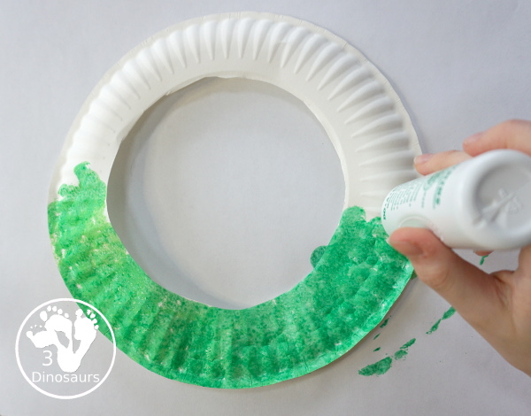 Football Wreath Craft For Kids - a fun wreath craft for a football theme. You have a green wreath with white lines and footballs around the wreath. Great for any football theme. - 3Dinosaurs.com