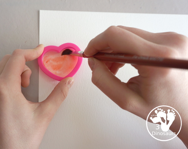 Rainbow Heart Watercolor Painting - a fun heart shape cookie cutter painting you can do with kids. - 3Dinosaurs.com