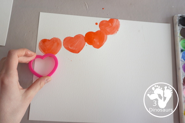 Rainbow Heart Watercolor Painting - a fun heart shape cookie cutter painting you can do with kids. - 3Dinosaurs.com