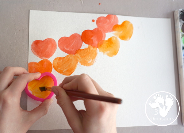 Rainbow Heart Watercolor Painting - a fun heart shape cookie cutter painting you can do with kids. - 3Dinosaurs.com