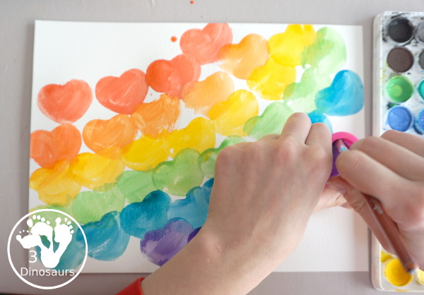 Rainbow Heart Watercolor Painting - a fun heart shape cookie cutter painting you can do with kids. - 3Dinosaurs.com