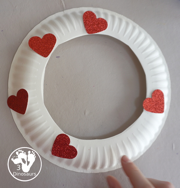 Rainbow Heart Wreath - made with glitter hearts and a paper plate that is super simple to put together for  heart theme of Valentines - 3Dinosaurs.com