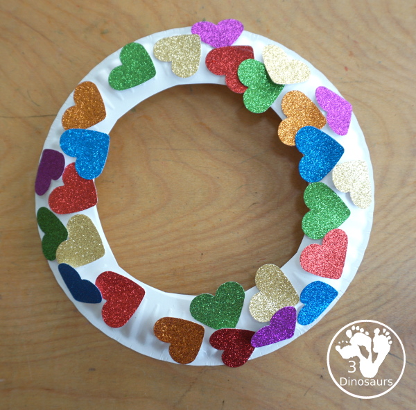 Rainbow Heart Wreath - made with glitter hearts and a paper plate that is super simple to put together for  heart theme of Valentines - 3Dinosaurs.com