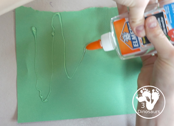 Tissue Paper Truffula Tree Craft you can make to go with the book the Lorax. It is simple for kids of different ages to make for a Dr Seuss Craft. - 3Dinosaurs.com