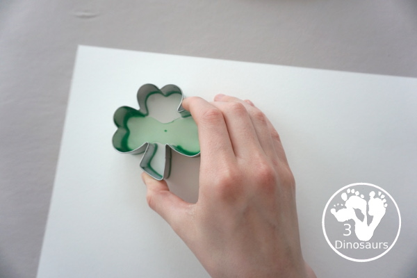 Clover Stamping Painting For Kids - a fun cookie cutter painting for kids with clover cookie cutters a fun St. Patrick's Day activities for kids - 3Dinosaurs.com