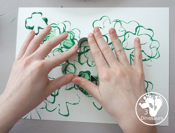 Clover Stamping Painting For Kids - a fun cookie cutter painting for kids with clover cookie cutters a fun St. Patrick's Day activities for kids - 3Dinosaurs.com