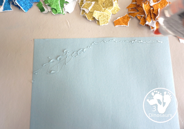 Torn Paper Glitter Rainbow Craft - a simple rainbow you can make with torn glitter paper. A simple rainbow for kids tot to kindergarten - 3Dinosaurs.com