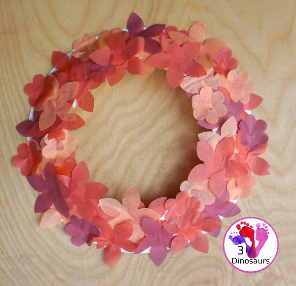 Tissue Paper Flower Wreath Craft - a fun wreath made with tissues paper flower and a paper plate. Super easy for different ages to do this craft. 3Dinosaurs.com