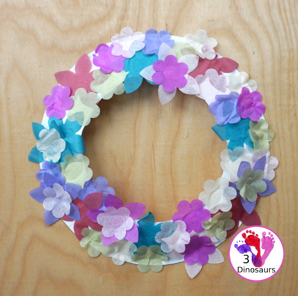 Tissue Paper Flower Wreath Craft - a fun wreath made with tissues paper flower and a paper plate. Super easy for different ages to do this craft. 3Dinosaurs.com