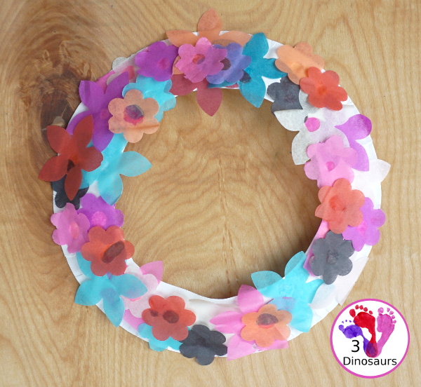 Tissue Paper Flower Wreath Craft - a fun wreath made with tissues paper flower and a paper plate. Super easy for different ages to do this craft. 3Dinosaurs.com