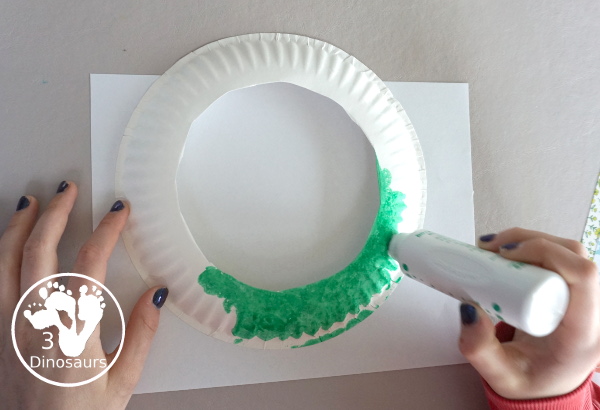  Easter Wreath Craft for Kids a simple easter wreath you can make with scrapbook paper and paper plate. A perfect craft for kids to make. - 3Dinosaurs.com