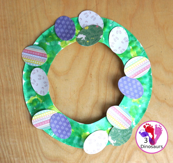  Easter Wreath Craft for Kids a simple easter wreath you can make with scrapbook paper and paper plate. A perfect craft for kids to make. - 3Dinosaurs.com