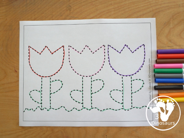 Free Tulip Fine Motor Mat Printables - with two version of a tulip for different skill levels with a single tulip flower and three flowers on a page with ground, stem and leaves - you have a flower template printable, flower tracing printable, flower dot marker printable, and flower q-tip printable - 3Dinosaurs.com