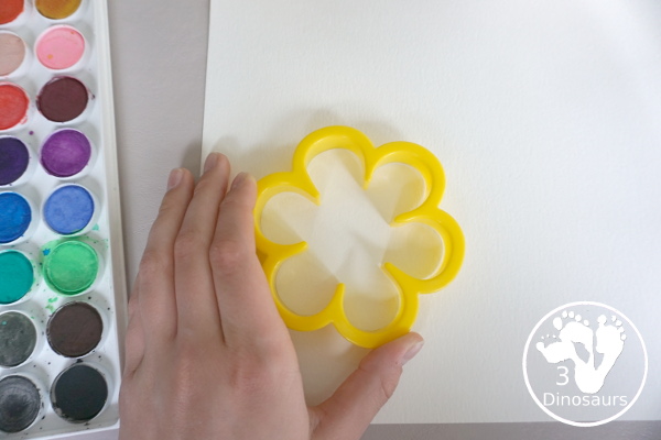 Watercolor Flower Painting with Cookie Cutters - a fun way for kids of all ages to paint flowers and have a fun time making a page full of flowers for spring or mothers day - 3Dinosaurs.com