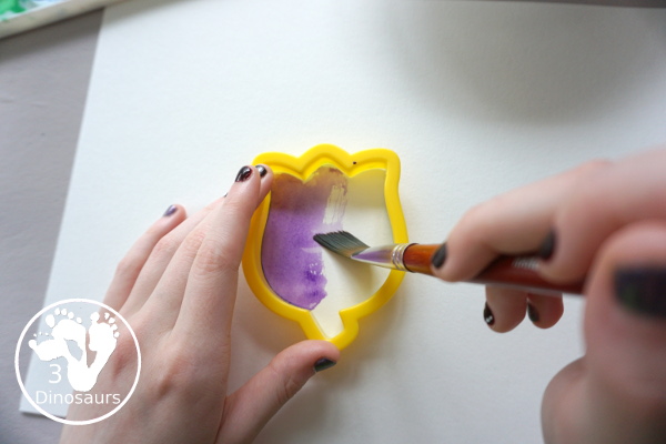 Watercolor Flower Painting with Cookie Cutters - a fun way for kids of all ages to paint flowers and have a fun time making a page full of flowers for spring or mothers day - 3Dinosaurs.com