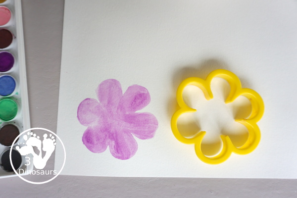 Watercolor Flower Painting with Cookie Cutters - a fun way for kids of all ages to paint flowers and have a fun time making a page full of flowers for spring or mothers day - 3Dinosaurs.com