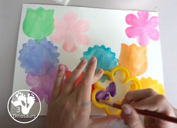 Watercolor Flower Painting with Cookie Cutters - a fun way for kids of all ages to paint flowers and have a fun time making a page full of flowers for spring or mothers day - 3Dinosaurs.com