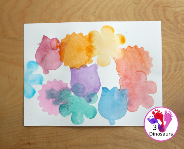 Watercolor Flower Painting with Cookie Cutters - a fun way for kids of all ages to paint flowers and have a fun time making a page full of flowers for spring or mothers day - 3Dinosaurs.com