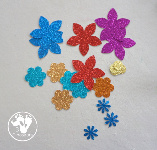 Flower Glitter Wreath Craft - a fun wreath made with a paper plate and flitter flower made from crafts punches.- - All the supplies that you need for the craft - 3Dinosaurs.com