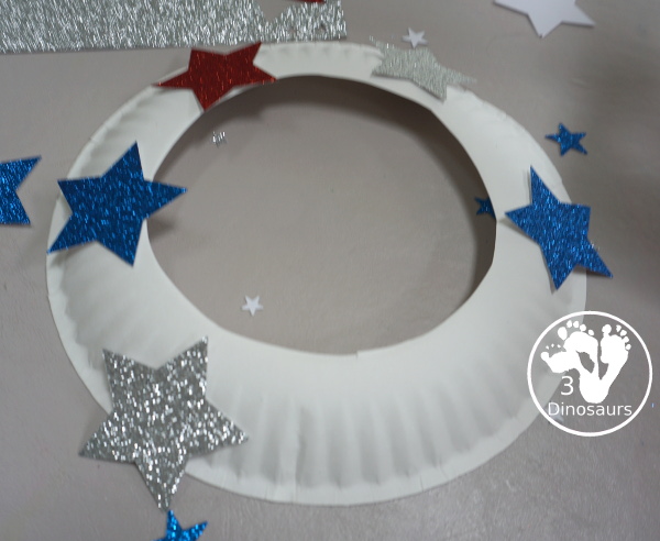 Red White & Blue Star Paper Plate Wreath for Kids - This is great for the 4th of July, Flag Day or a red white and blue theme and is super easy to make - 3Dinosaurs.com