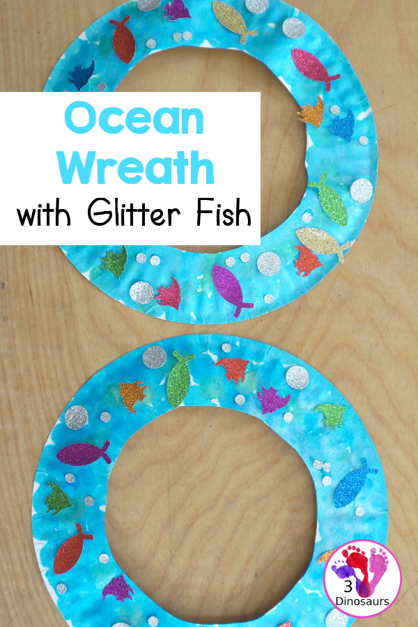 Ocean Wreath with Glitter Fish - A great wreath you can make with an ocean theme. It is a simple and easy-to-make craft for kids of different ages. You have a paper plate, glitter paper, glue and fish punches. - 3Dinosaurs.com