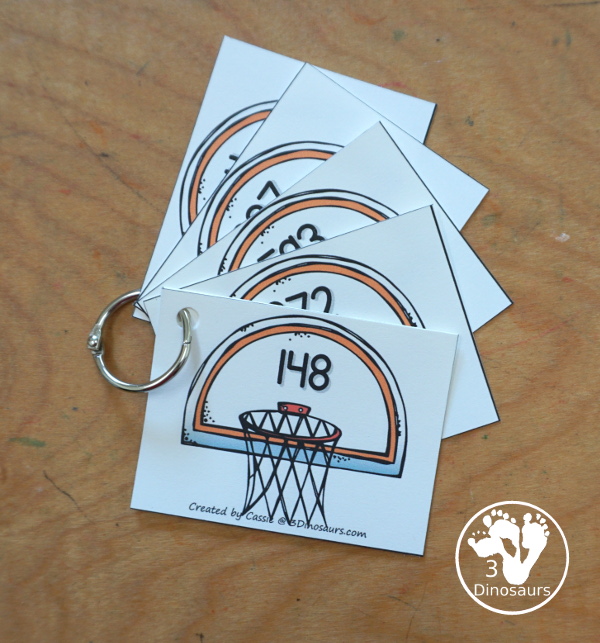 Free Basketball Place Value Arrow Cards - you have place value task cards with basketball place value arrow cards to build the numbers on the task cards. You have place value for thousands, hundreds, and ones. - 3Dinosaurs.com