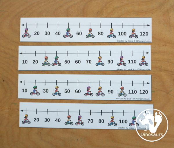 Free Bike Skip Counting Number Line Printables - skip counting number line strips with 10 skip counting. With kids on bikes covering some of the numbers. With four skip counting strips for each number and a matching worksheet to record the numbers.- 3Dinosaurs.com