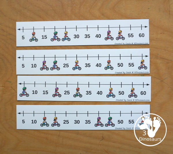 Free Bike Skip Counting Number Line Printables - skip counting number line strips with 5 skip counting. With kids on bikes covering some of the numbers. With four skip counting strips for each number and a matching worksheet to record the numbers.- 3Dinosaurs.com