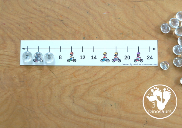 Free Bike Skip Counting Number Line Printables - skip counting number line strips with 2, 5 and 10 skip counting. With kids on bikes covering some of the numbers. With four skip counting strips for each number and a matching worksheet to record the numbers.- 3Dinosaurs.com