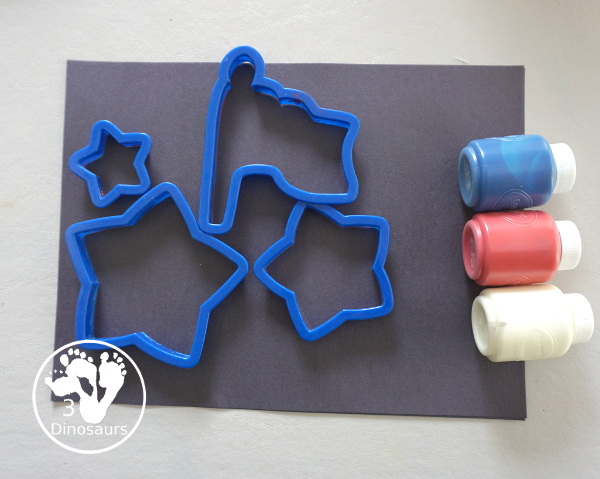 Red, White, and Blue Stamping - a simple painting with cookie cutters that you can do with kids using a flag shape and starts for the Fourth of July. - 3Dinosaurs.com