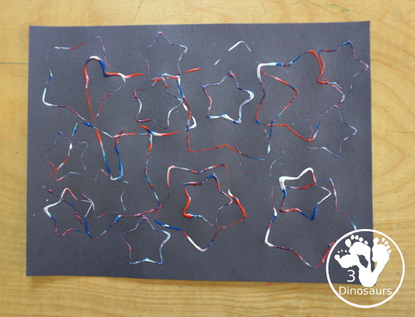 Red, White, and Blue Stamping - a simple painting with cookie cutters that you can do with kids using a flag shape and starts for the Fourth of July. - 3Dinosaurs.com