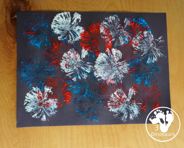 Red White and Blue Firework Painting - a fun painting to do for the Fourth of July with red, white and blue colors on black paper - 3Dinosaurs.com