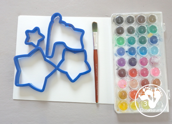 Stars & Flag Watercolor Painting with Cookie Cutters - a simple painting activity that you can do with kids with red and blue colors painting inside stars and flags.- 3Dinosaurs.com